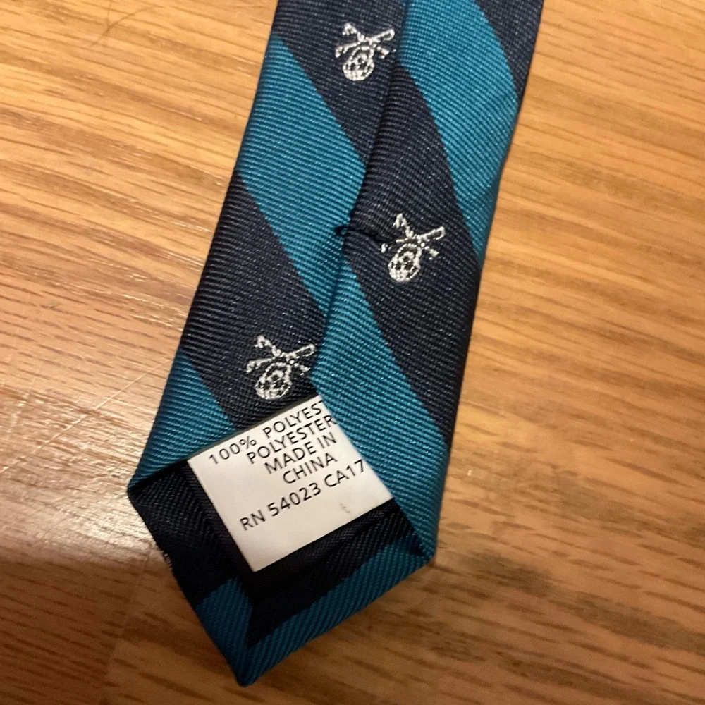 Striped Tie with Skulls and Crossbones on it. Great for Teen, Young Adult.